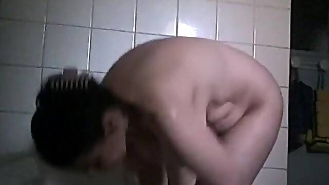 Big boobed stepmom spied in the bathroom