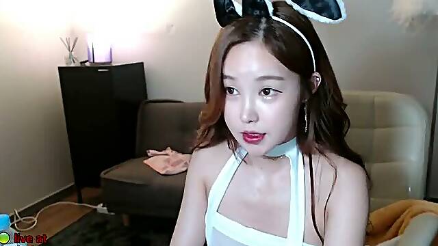 Korean busty young camgirl in lingerie masturbates