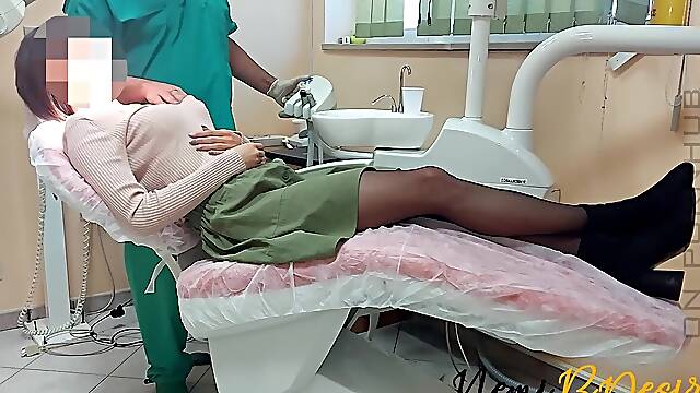 The services of the dentist and his assistant give a pretty smile to the youthful and insane patient